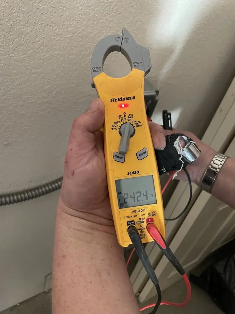 Voltage testing with clamp meter during Circuit Breaker Repair in Applewood